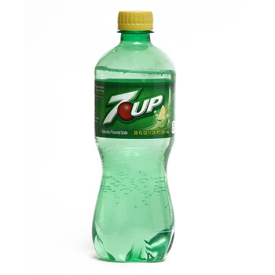 Green 7UP bottle with yellow cap on a white background
